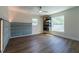 Stylish bedroom showcasing hardwood floors, built-in shelves, and a padded headboard for a cozy feel at 2721 Ingeborg Ct, Windermere, FL 34786