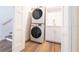 Convenient laundry room with stacked washer/dryer and utility sink at 2721 Ingeborg Ct, Windermere, FL 34786