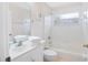 Bright bathroom with white tiling, a clean vanity, and combined shower and tub at 3203 Victoria Ln, Eustis, FL 32726