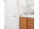 Well-lit bathroom featuring a wood vanity, white marble top, and modern fixtures at 3203 Victoria Ln, Eustis, FL 32726