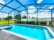 A screened-in pool and spa are the focal point, offering a private outdoor oasis, perfect for relaxation at 3401 Lilac Way, Davenport, FL 33897