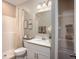 This bathroom boasts a single sink vanity, tile floors, and tile shower with seating at 4898 Lyric Dr, Mascotte, FL 34753