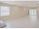 Bright, open living area with tile flooring and sliding glass doors to the backyard at 4906 Lyric Dr, Mascotte, FL 34753