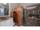 Well-lit bathroom with a sauna and mosaic tile in the shower at 4978 Fawn Ridge Pl, Sanford, FL 32771