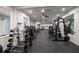 Modern gym with a variety of weight machines, free weights, and mirrored walls at 4978 Fawn Ridge Pl, Sanford, FL 32771