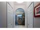 Hallway that features storage on each side and an arched entry to the bathroom at 4978 Fawn Ridge Pl, Sanford, FL 32771