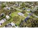 Bird's-eye view of the property, highlighting its spacious yard and tree-lined surroundings at 522 Wisconsin Ave, St Cloud, FL 34769