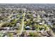 Wide aerial view of a residential neighborhood featuring mature trees and well-maintained lawns at 522 Wisconsin Ave, St Cloud, FL 34769