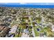 Panoramic aerial view highlighting the property’s location in a residential neighborhood near a lake at 522 Wisconsin Ave, St Cloud, FL 34769