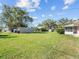 Spacious backyard with ample green space, including a shed for storage or hobbies at 522 Wisconsin Ave, St Cloud, FL 34769