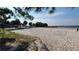 A large sandy volleyball court is set up near a beach and a lake at 522 Wisconsin Ave, St Cloud, FL 34769