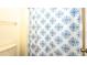 Bathroom with a shower featuring a decorative blue and white shower curtain at 549 Hunter Cir, Kissimmee, FL 34758