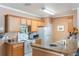 Efficient kitchen features essential appliances and ample countertop space at 5550 E Michigan St # 1210, Orlando, FL 32822