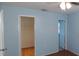 A bedroom featuring wood flooring and a view to a closet at 5843 Willow Leaf Ct, Orlando, FL 32807