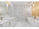 Bathroom featuring marble floors, gold accents, a bathtub, and dual vanities at 6229 Indian Meadow St, Orlando, FL 32819