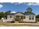 Charming single-story home with a cozy front porch, white picket fence, and well-maintained landscaping at 630 3Rd Street St, Oviedo, FL 32765