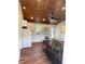 Bright kitchen featuring white cabinets and modern appliances with a ceiling fan at 630 3Rd Street St, Oviedo, FL 32765