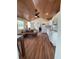 Open floor plan featuring modern living room and kitchen with ceiling fan and wood ceiling at 630 3Rd Street St, Oviedo, FL 32765