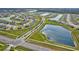 Aerial view of a Primary-planned community with ponds and lush landscaping at 64 Citrine Loop, Kissimmee, FL 34758