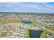 High aerial view of well-planned community showcasing houses next to picturesque lakes, with easy access to highways at 64 Citrine Loop, Kissimmee, FL 34758