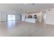 Open floor plan with tile flooring, kitchen with stainless steel appliances at 64 Citrine Loop, Kissimmee, FL 34758