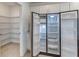 Stainless steel refrigerator offers ample storage, complemented by walk-in pantry shelving at 64 Citrine Loop, Kissimmee, FL 34758