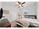 Cozy bedroom with a comfortable bed, soft rug, closet, and natural light, creating a relaxing retreat at 704 Hyperion Dr, Debary, FL 32713