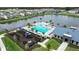 Aerial view of a community pool, clubhouse, playground and lake at 704 Hyperion Dr, Debary, FL 32713