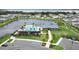 Aerial view of a community pool, playground, clubhouse, pond, and walking path at 704 Hyperion Dr, Debary, FL 32713