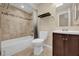 Bathroom featuring a bathtub with a shower and a dark wood vanity at 7448 Grand Ct, Winter Park, FL 32792