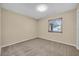 Bedroom featuring a single window and carpeted floors at 7448 Grand Ct, Winter Park, FL 32792