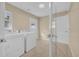 Bright laundry room with tile flooring, washer and dryer, and access to the backyard at 7448 Grand Ct, Winter Park, FL 32792