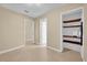 Room with tile flooring leads to a storage area with shelves at 7448 Grand Ct, Winter Park, FL 32792