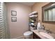 Cozy bathroom with a sleek vanity, neatly stacked towels, and stylish decor creating a relaxing atmosphere at 7449 Sugar Bend Dr # 7449, Orlando, FL 32819