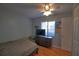 Relaxing bedroom with hardwood floors, a ceiling fan, and natural light with a view to the door at 7449 Sugar Bend Dr # 7449, Orlando, FL 32819