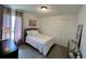 Cozy bedroom with a double bed, closet, neutral tones, and wood-look plank flooring at 7885 Brockwood Cir, Orlando, FL 32822