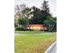 Welcoming Windsor community sign surrounded by lush landscaping and vibrant green grass at 8744 Currituck Sound Ln, Orlando, FL 32829