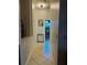 Hallway with neutral paint and tile flooring leading to another room at 8744 Currituck Sound Ln, Orlando, FL 32829