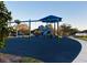 Community playground with various play structures, slides, and a safe, soft surface at 8744 Currituck Sound Ln, Orlando, FL 32829