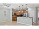 Kitchen featuring stainless appliances and a breakfast bar overlooking the living area at 981 Galway Blvd, Apopka, FL 32703