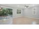 Open concept living room with sliding glass doors to the backyard at 981 Galway Blvd, Apopka, FL 32703