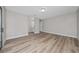 Large room featuring wood-look floors with an en suite bathroom at 986 Sweetbrier Dr, Deltona, FL 32725