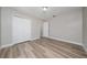 Bedroom featuring wood-look floors, neutral walls, and built in closet at 986 Sweetbrier Dr, Deltona, FL 32725