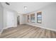 Bedroom features wood-look floors, neutral walls, and multiple windows offering ample light at 986 Sweetbrier Dr, Deltona, FL 32725