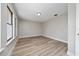 Bright bedroom featuring wood-look floors, neutral walls, and windows for natural light at 986 Sweetbrier Dr, Deltona, FL 32725