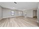 Bright and airy living room with modern flooring, fresh paint, and a view of the front entrance at 986 Sweetbrier Dr, Deltona, FL 32725