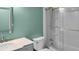 Bathroom featuring marble countertops, modern fixtures and white subway tiled shower/tub at 1010 Corbin Ct, Oviedo, FL 32765
