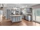 Bright open kitchen with an island, stainless steel appliances, and modern cabinetry at 1010 Corbin Ct, Oviedo, FL 32765