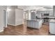 Spacious open kitchen with an island, stainless steel appliances, and contemporary lighting at 1010 Corbin Ct, Oviedo, FL 32765