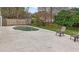 Outdoor backyard area with a kidney-shaped pool surrounded by a concrete patio and lawn at 1010 Corbin Ct, Oviedo, FL 32765